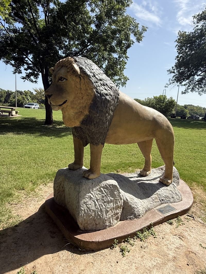 The Lion Who Owns the Place — The mane, and the sculpted stone under him