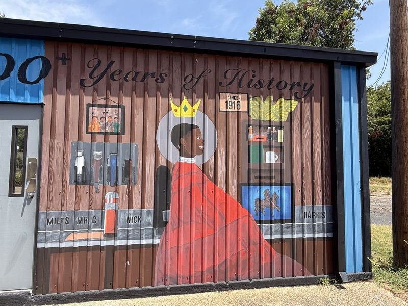 A Hundred Years of Haircuts — The painted shop, and the chairs by name
