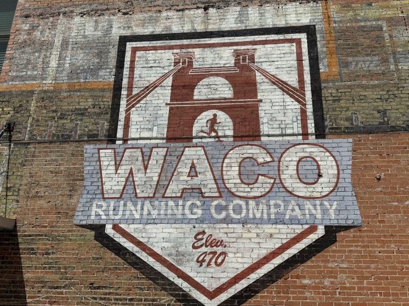 Waco Running Company's bridge shield sign on Franklin Avenue in downtown Waco