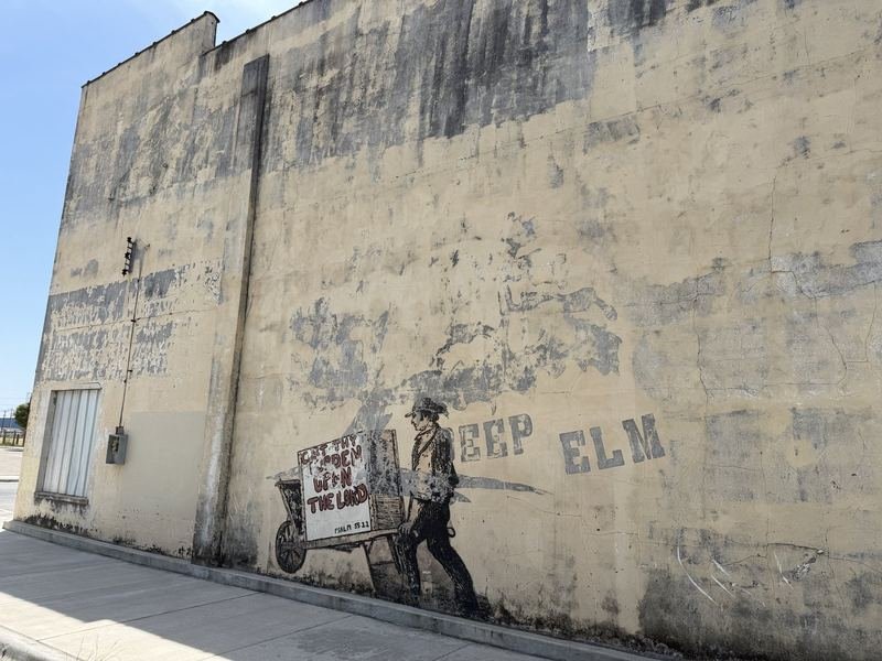 The Man With the Pushcart — The whole wall, with DEEP ELM behind him