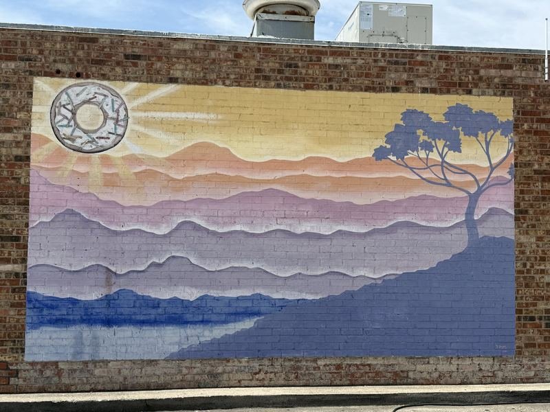 The Sun Came Up a Doughnut — Sunrise mural signed D. Unger, Waco, Texas