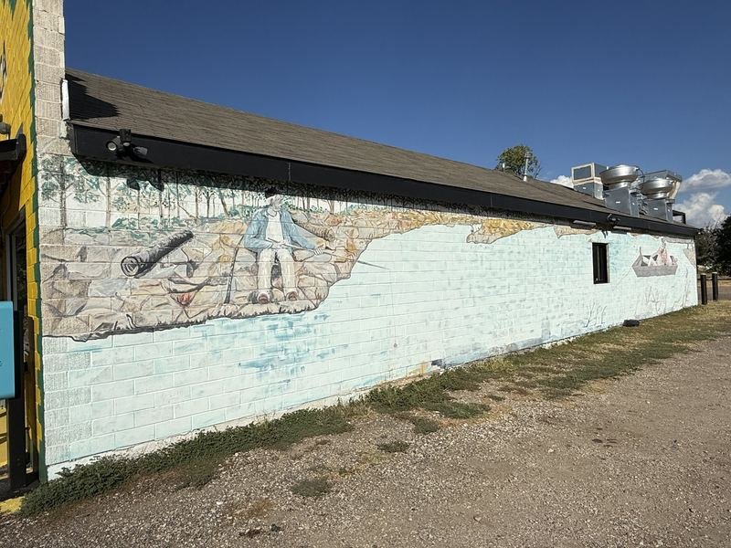 The Long Table on Taylor Street — The opposite wall: a fisherman on the rocks, unsigned