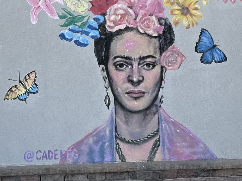 There's a Paleta in Frida's Bouquet — The face, the butterflies, and the signature: @CADEKEG