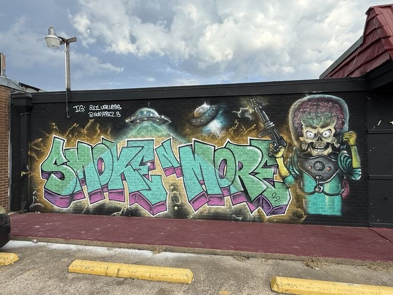 The Bear and the Honey Pot — The graffiti panel — aliens over the shop name