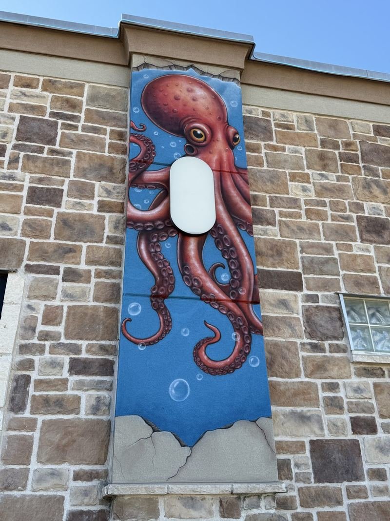 The Building With Tattoos — The octopus takes the corner