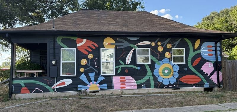 The Night Garden — Botanical mural on a black house, Waco, Texas