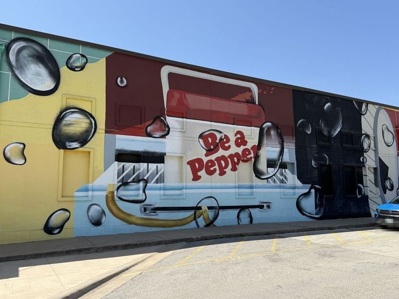 Dr Pepper Museum mural wrap with a giant vintage vending machine and floating soda bubbles
