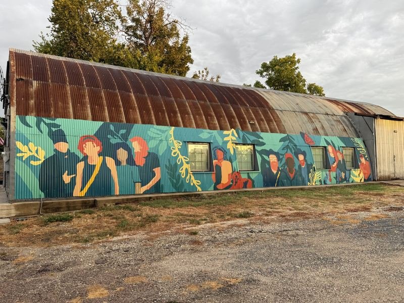 The Crowd at the Hangar — mural in Waco, Texas