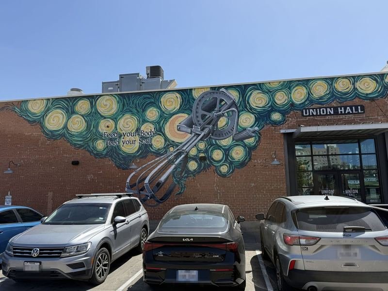 Mural of a swirling Van Gogh-style night sky being whipped by a giant vintage hand-crank egg beater at Union Hall in downtown Waco