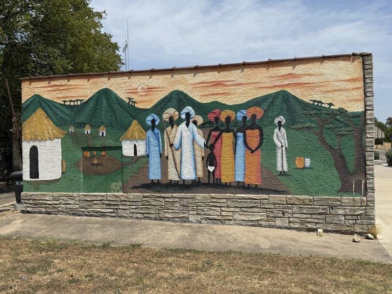 The Village at the Top of the Avenue — mural in Waco, Texas
