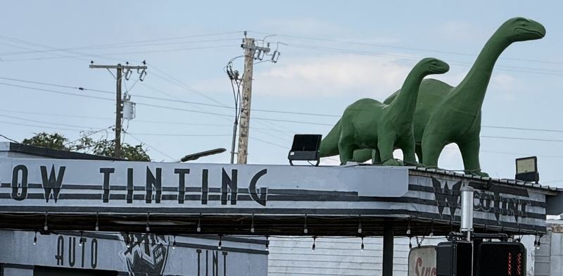 Two Dinosaurs on a Tint Shop Roof — The Sinclair sign under the canopy