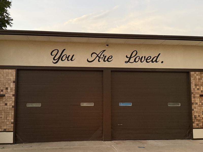 You Are Loved — The lettering over the garage doors