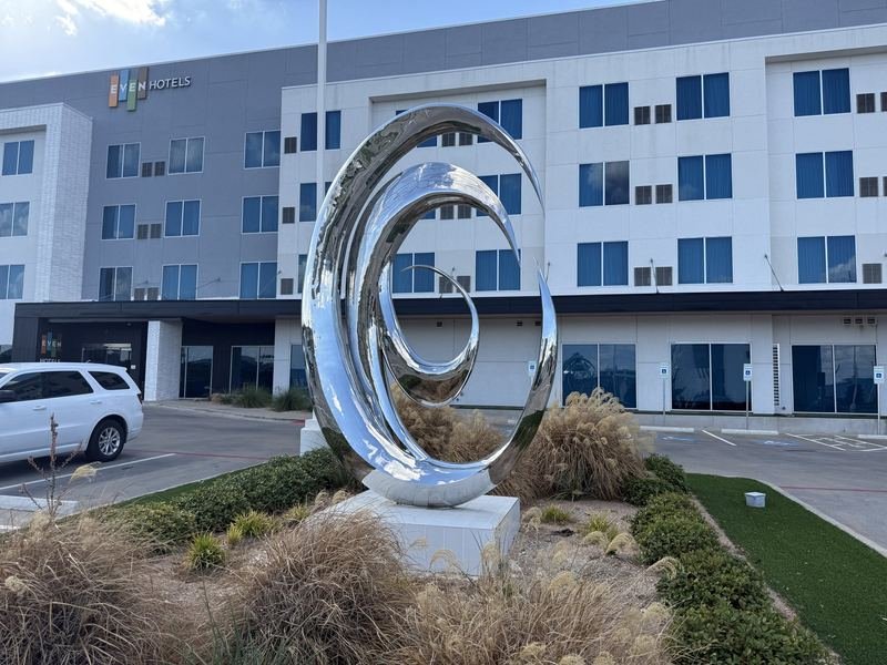 The Silver Whirlpool — Mirror-polished stainless steel spiral, Waco, Texas