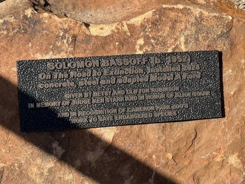 On the Road to Extinction — The plaque on the stone base