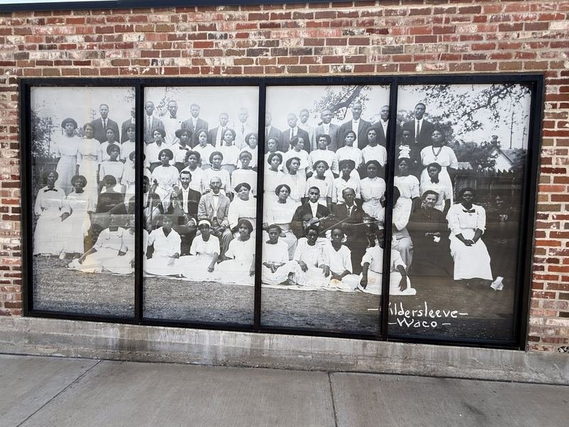 The Windows That Look Back a Hundred Years — hand-painted sign in Waco, Texas
