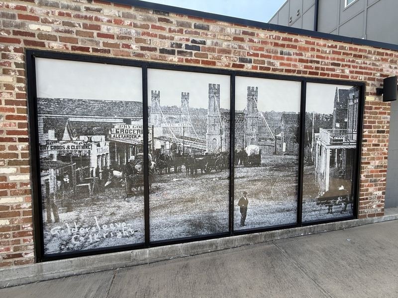 The Windows That Look Back a Hundred Years — The street looking east at the Suspension Bridge