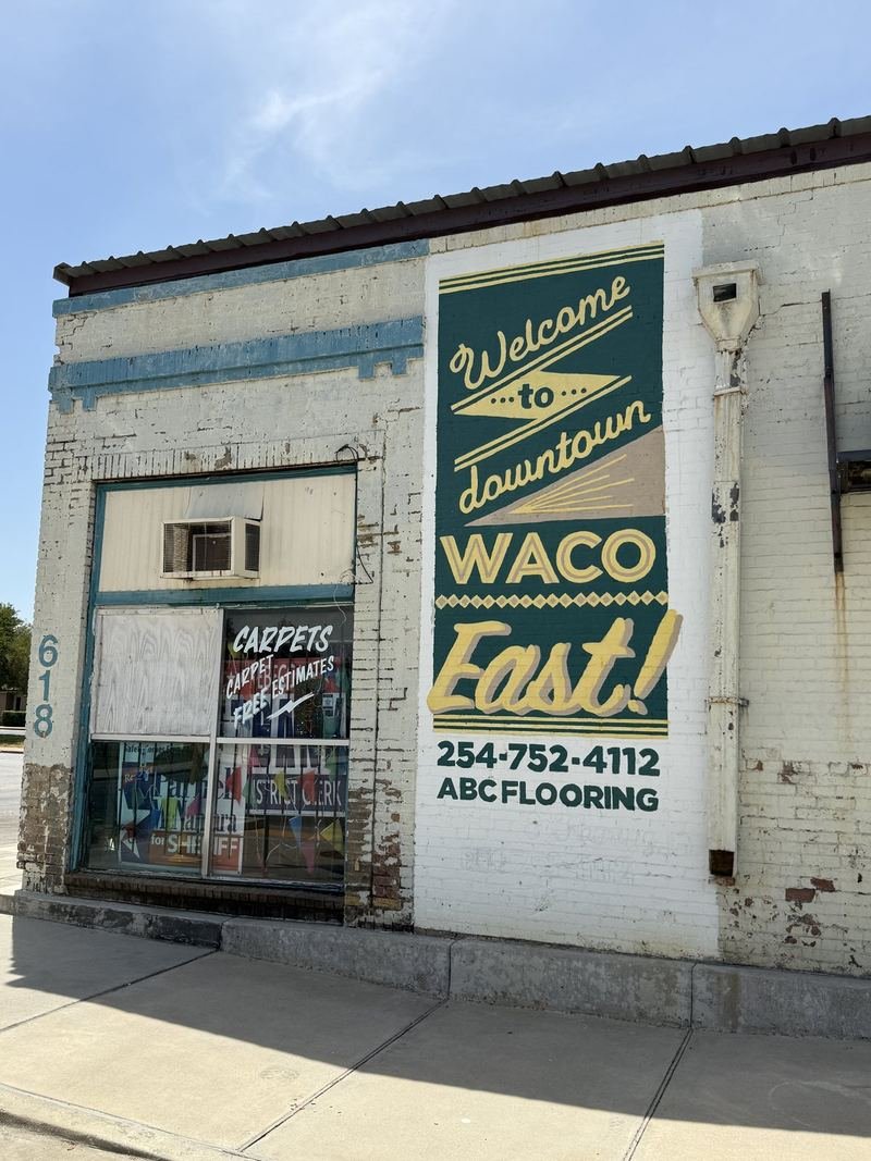 Welcome to Downtown Waco East — Hand-painted wall sign for ABC Flooring, Waco, Texas