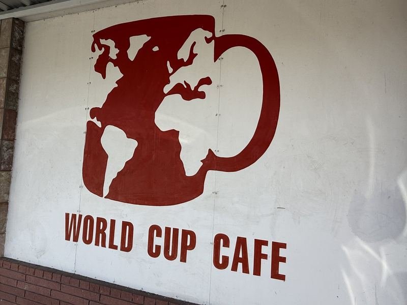 The Whole World in a Mug — Hand-painted World Cup Cafe sign, Waco, Texas
